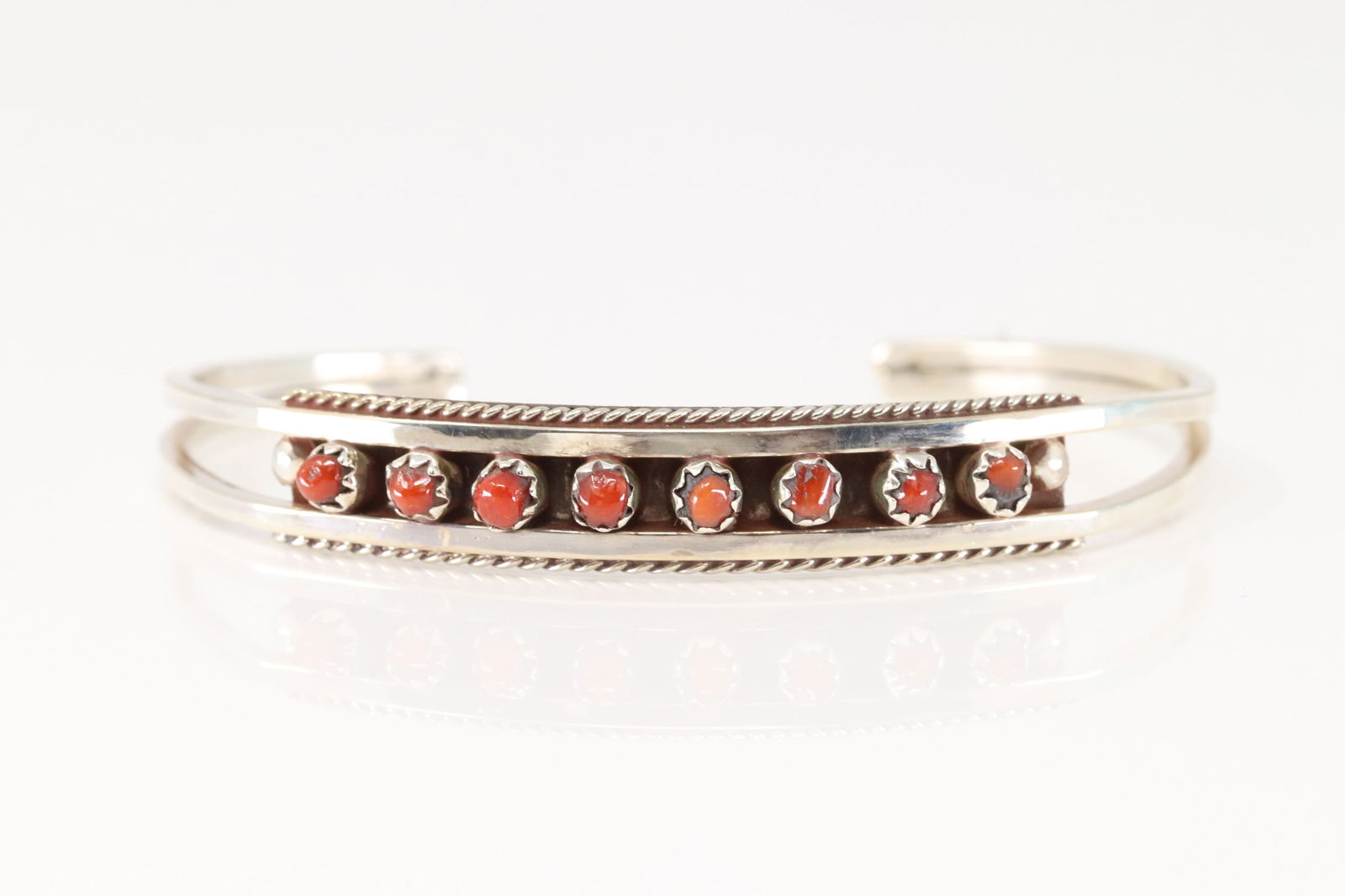 Native America Zuni Sterling Silver Coral Bracelet Cuff By Susie Livingston.: This is a Native America Zuni Sterling Silver Coral Bracelet Cuff By Susie Livingston.