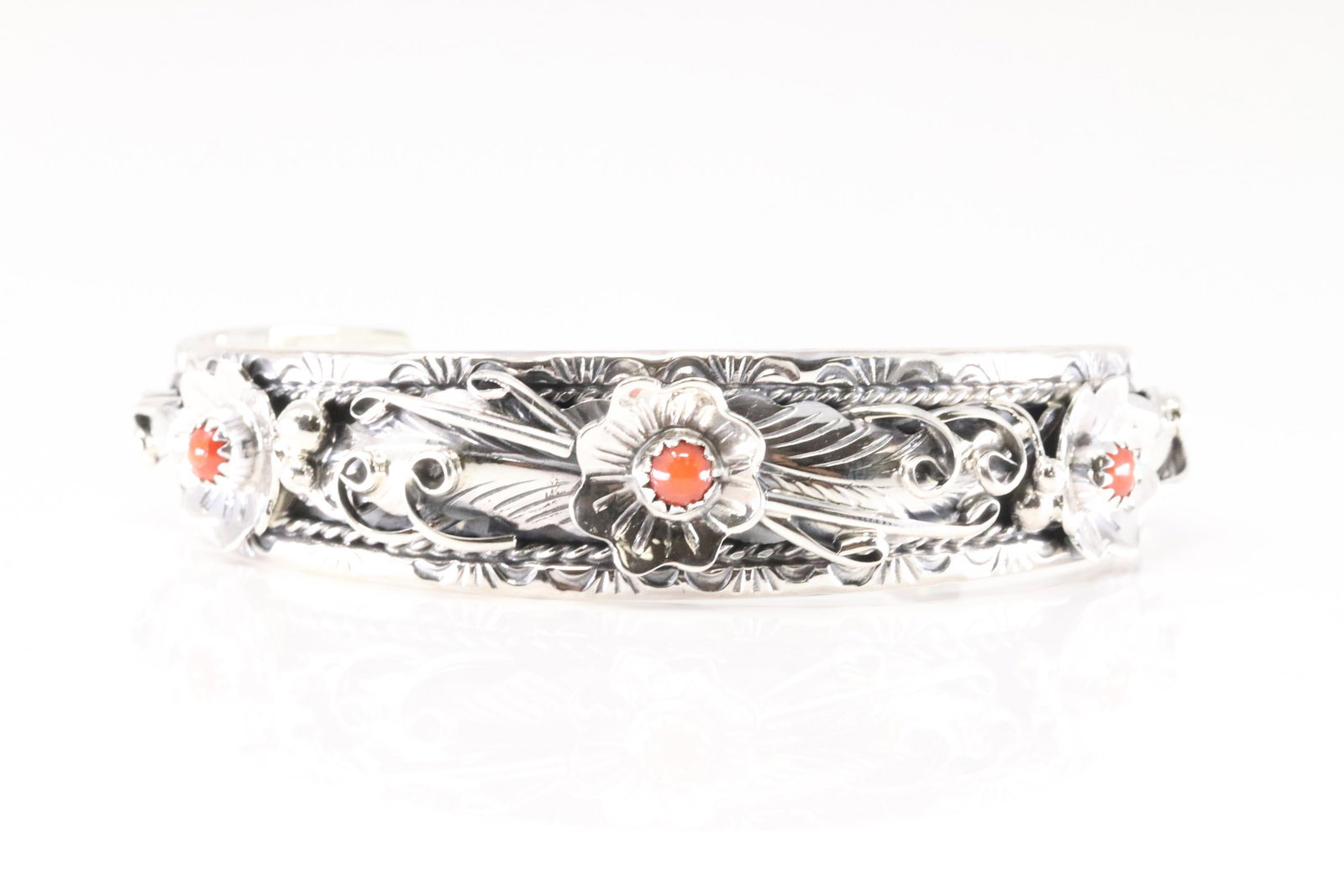 Native America Navajo Sterling Silver Coral Bracelet Floral Cuff By Bessie Joe.: This is a Native America Navajo Sterling Silver Coral Bracelet Floral Cuff By Bessie Joe.