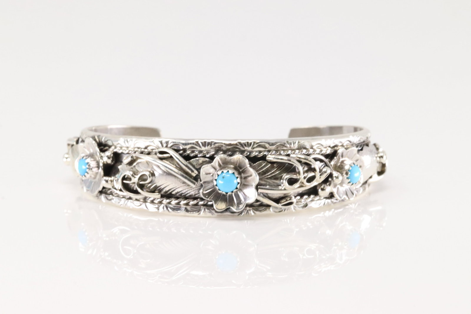 Native American Navajo Sterling Silver Turquoise Bracelet Floral Cuff By Bessie Joe.: This is a Native American Navajo Sterling Silver Turquoise Bracelet Floral Cuff By Bessie Joe.