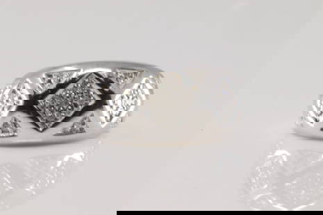 Elegant Diamond Ring 10Kt.: 10Kt White Gold Diamond Ring. This Wedding Band Ring has 20 Sparkling Round Diamonds. Ring size: 7.00. Total weight: 5.20 Grams.
