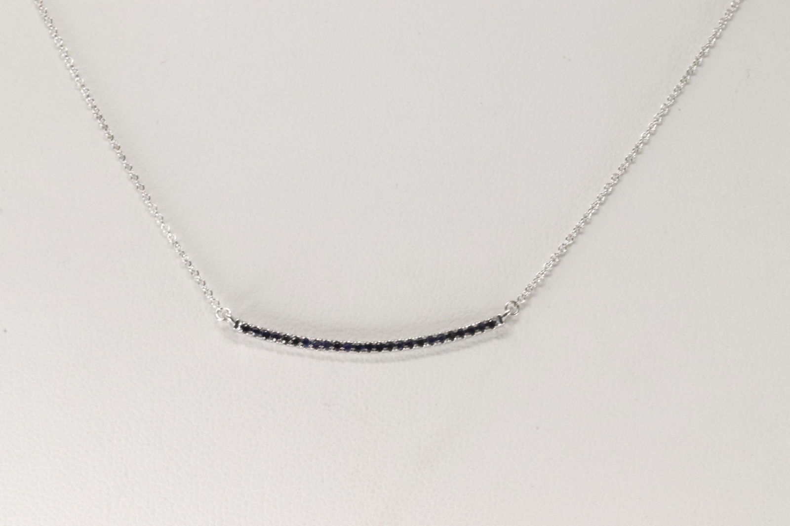 Sapphire Necklace 14Kt.: Ladies 14Kt White Gold Sapphire Necklace. This Elegant Necklace has 25 round Sapphires. Sapphires weight: 0.20ctw. Necklace length: 18.00"