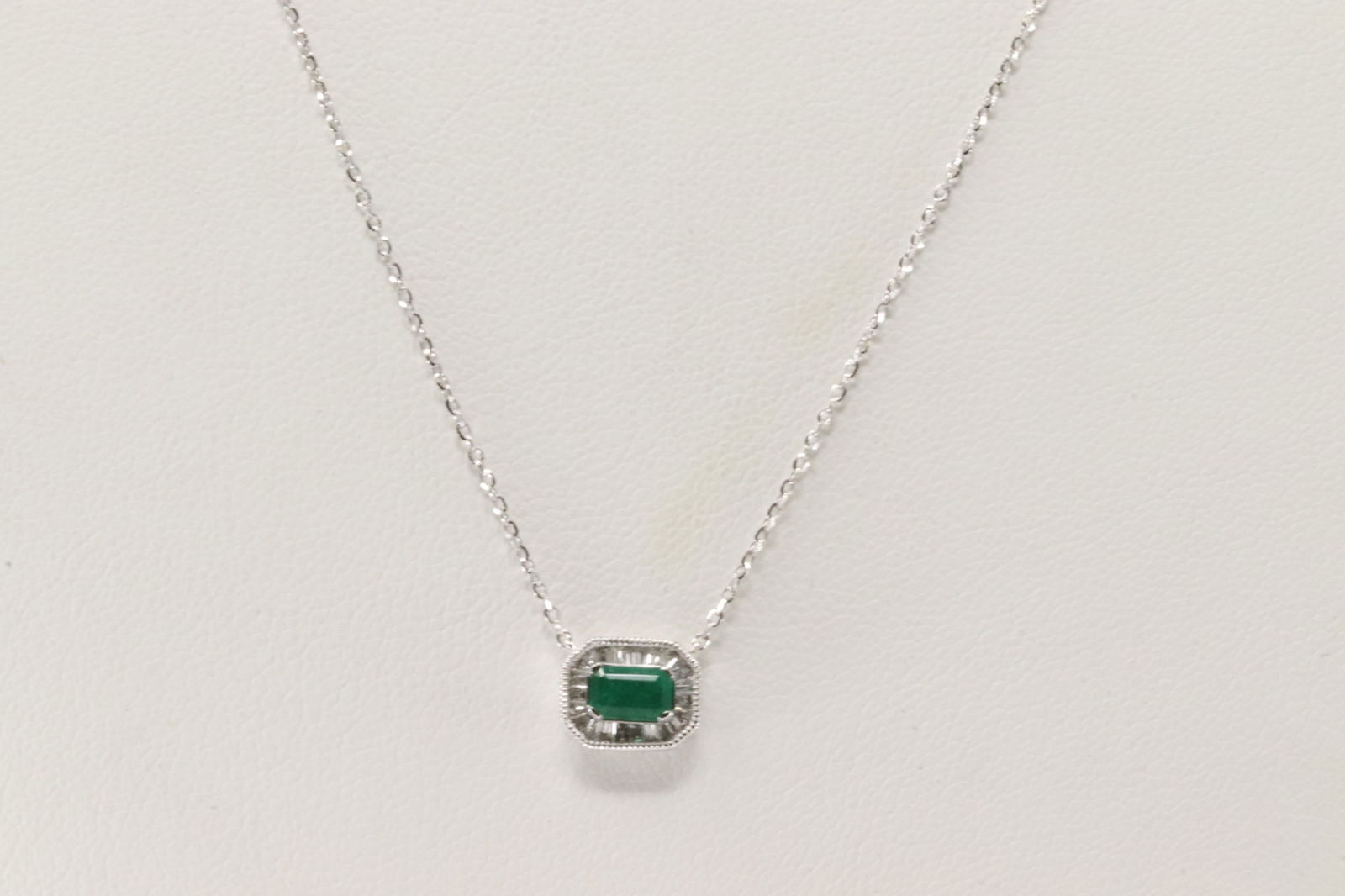 Emerald & Baguette Diamond Pendant / Necklace 14Kt.: Ladies 14Kt White Gold Emerald & Baguette Diamond Pendant / Necklace. This Necklace has Green Emerald with Baguette Diamonds. Diamonds weight: 0.16ctw. Emerald weight: 0.31ct. Necklace length: 18.00"