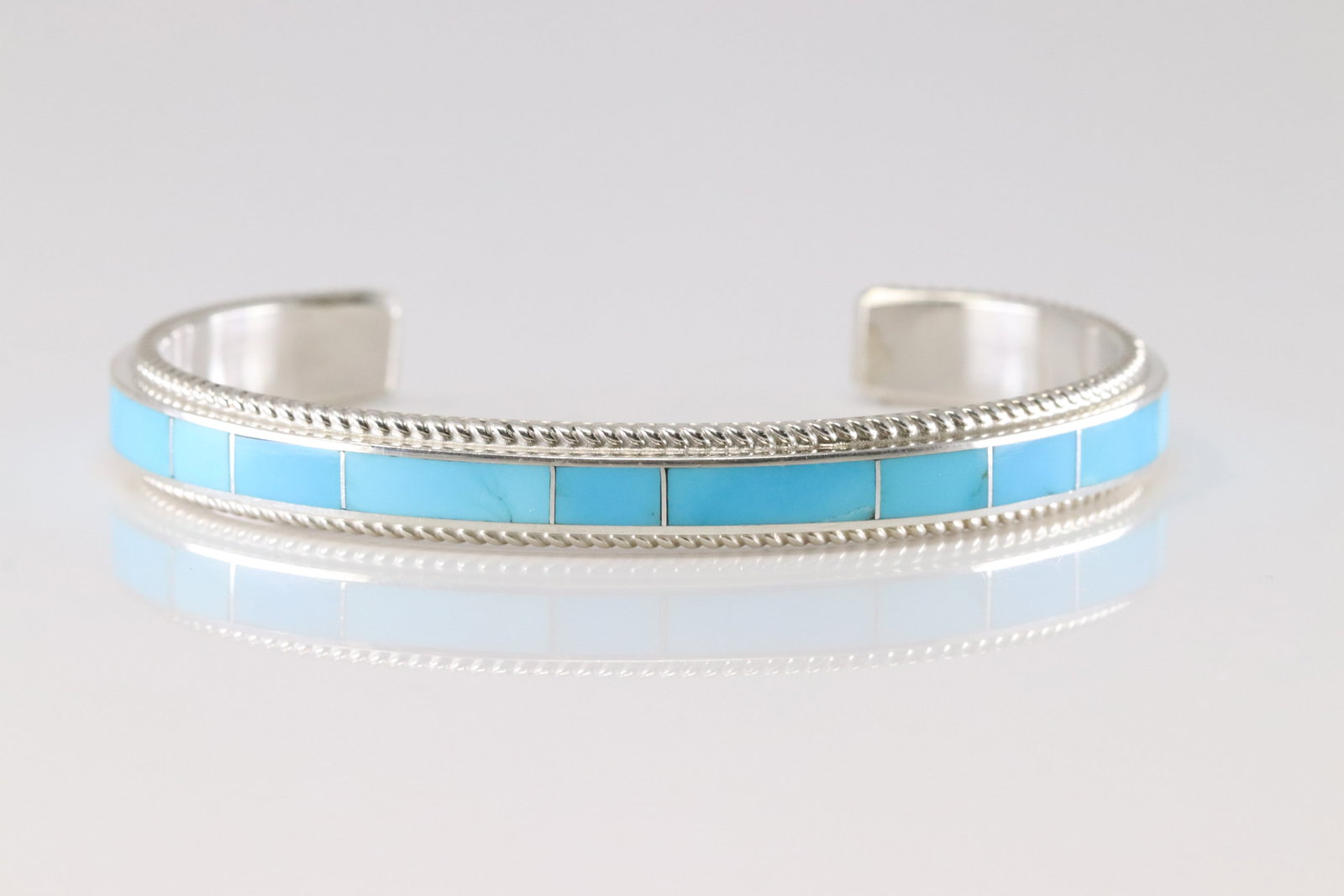 Native America Zuni Sterling Silver Turquoise Inlay Bracelet Cuff By Rick Booqua.: This is a Native America Zuni Sterling Silver Turquoise Inlay Bracelet Cuff By Rick Booqua.