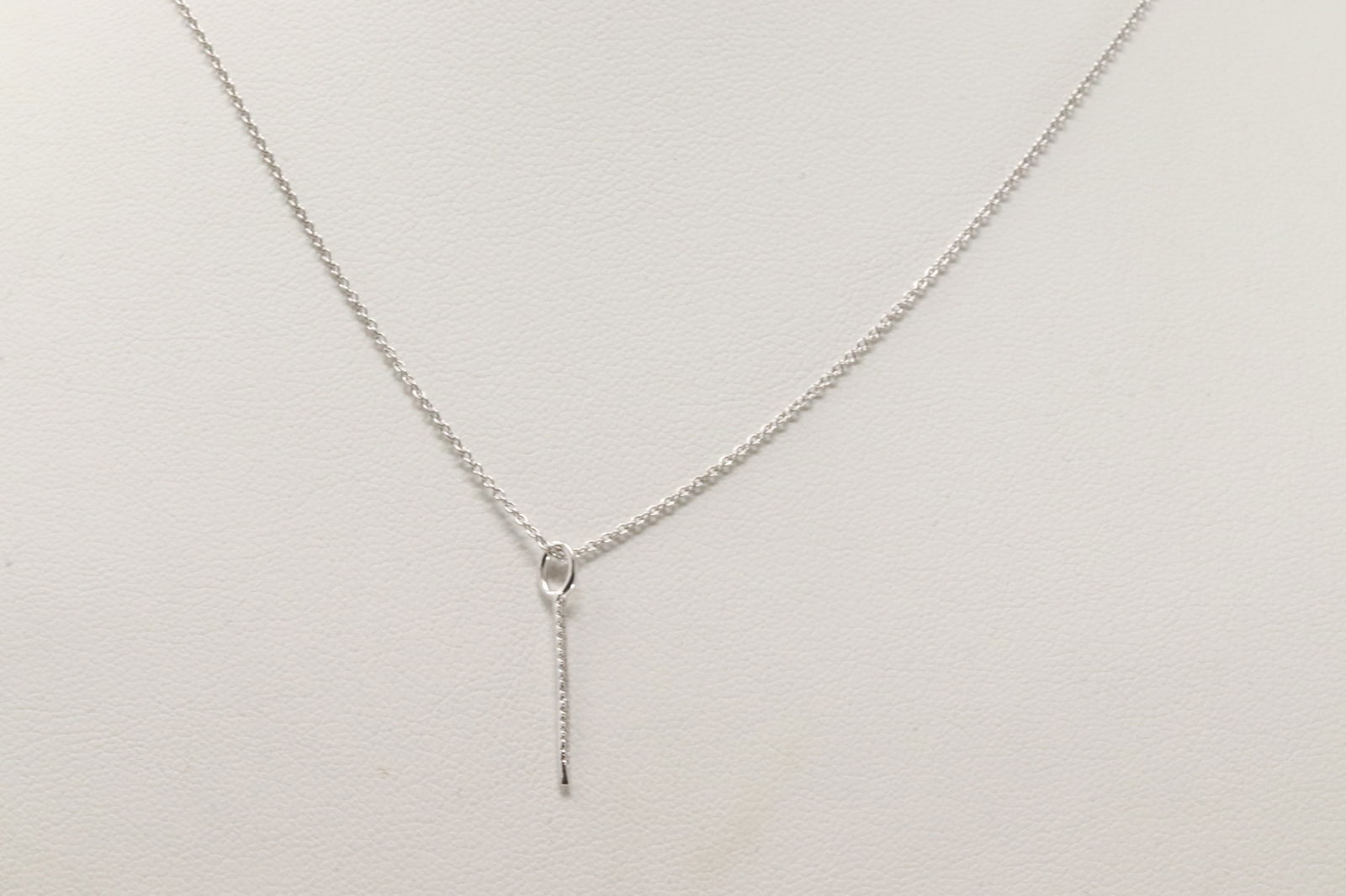 Diamond Needle Pendant / Necklace 14Kt.: 14Kt White Gold Diamond Needle Pendant / Necklace. This Necklace has Needle Pendant with Sparkling Diamonds. Diamonds weight: 0.03ctw. Necklace length: 20.00"