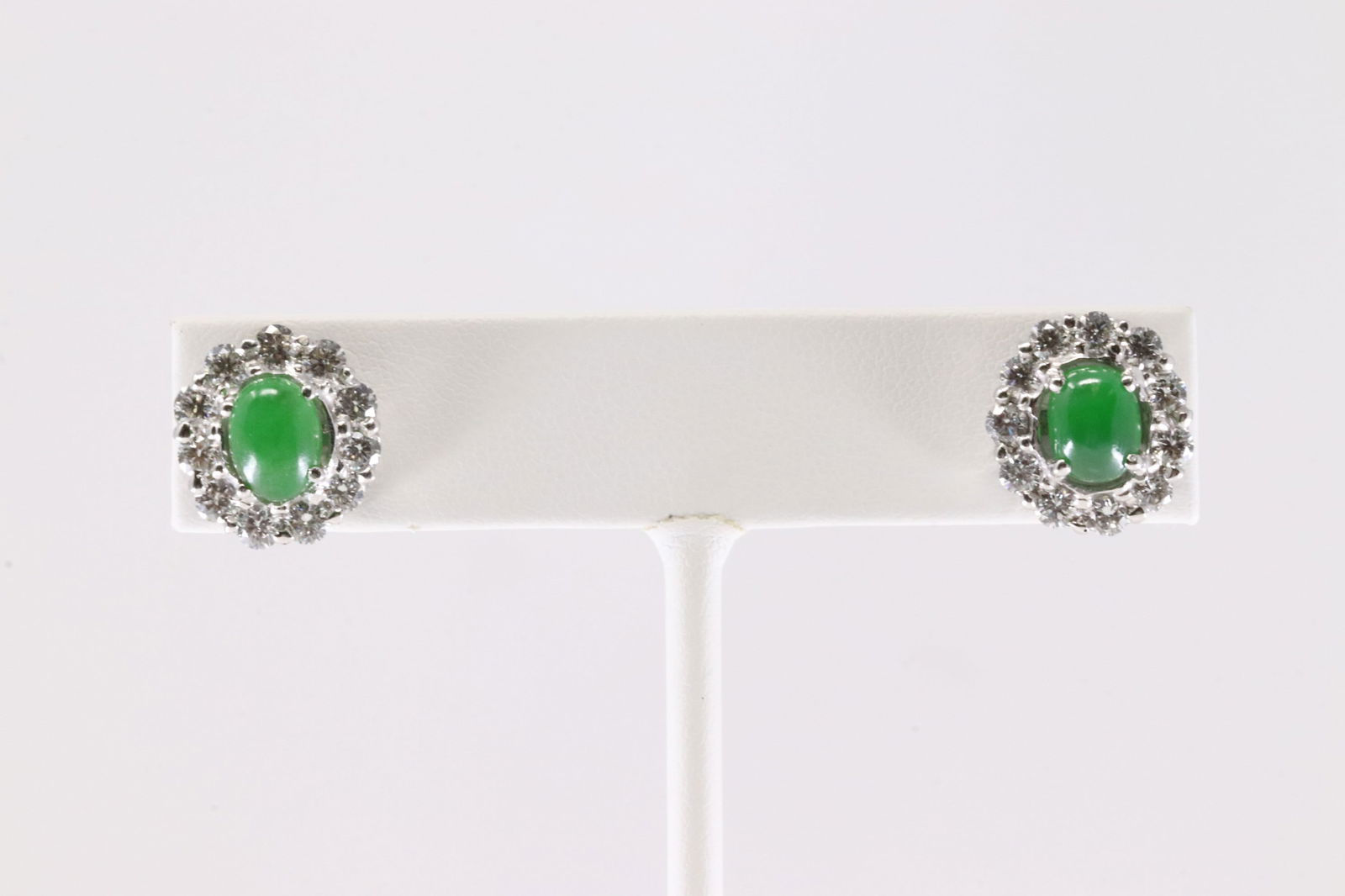 Jade & Diamond Stud Earring 18Kt.: Ladies 18Kt White Gold Jade & Diamond Stud Earring. This Elegant Stud Earring has Green Jade Stone Surrender by 11 Brilliants Natural Diamonds on To each. Jade Measure: 7.30 x5.70 mm. Diamonds weight