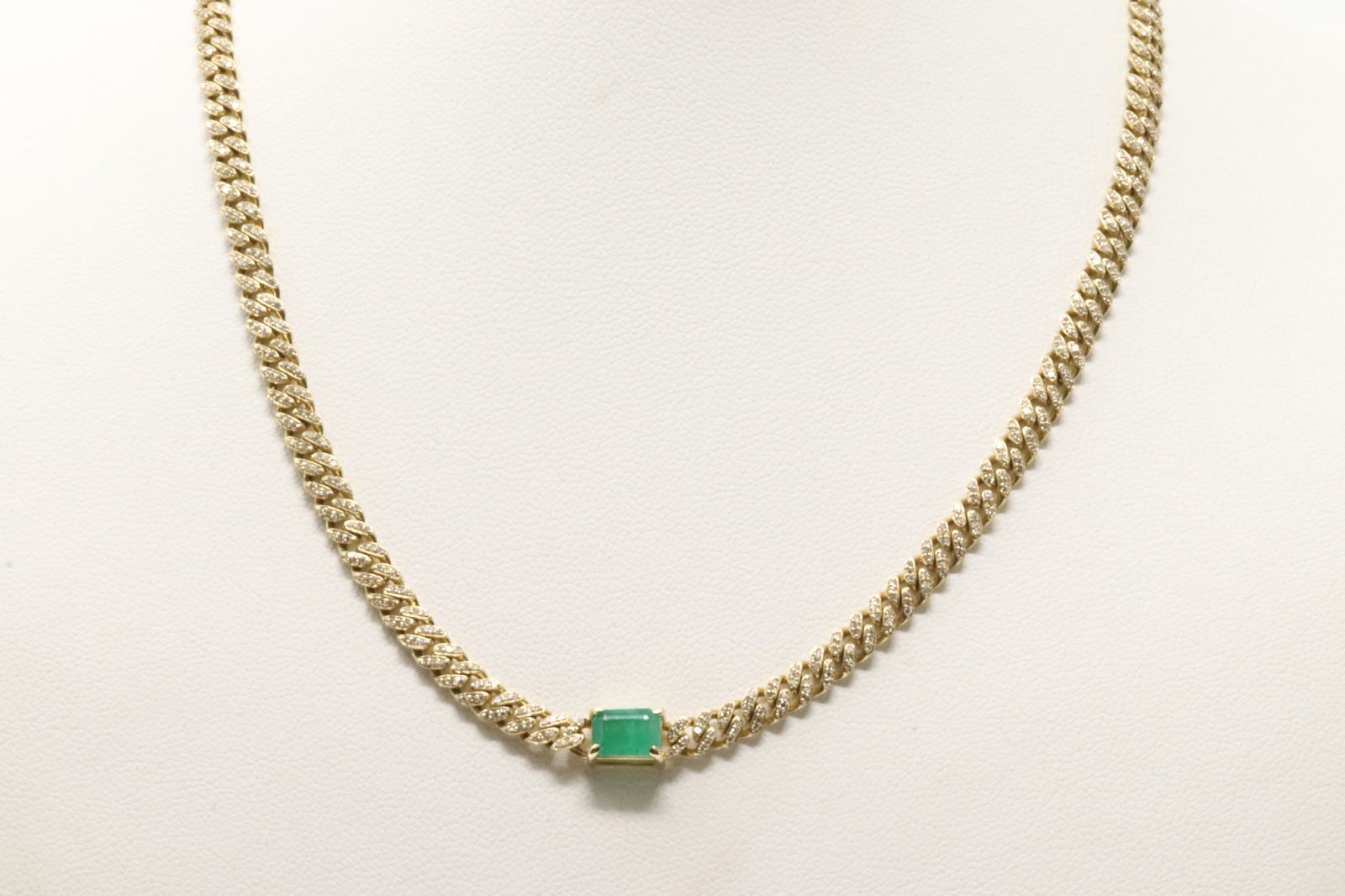 Emerald & Diamond Cuban Link Necklace 14Kt.: 14Kt Yellow Gold Emerald & Diamond Cuban Link Necklace. This Cuban Design Necklace has Cut Green Emerald with 726 Sparkling Accent Diamonds. Diamonds weight: 1.45ctw. Emerald weight: 1.17ct. Necklace