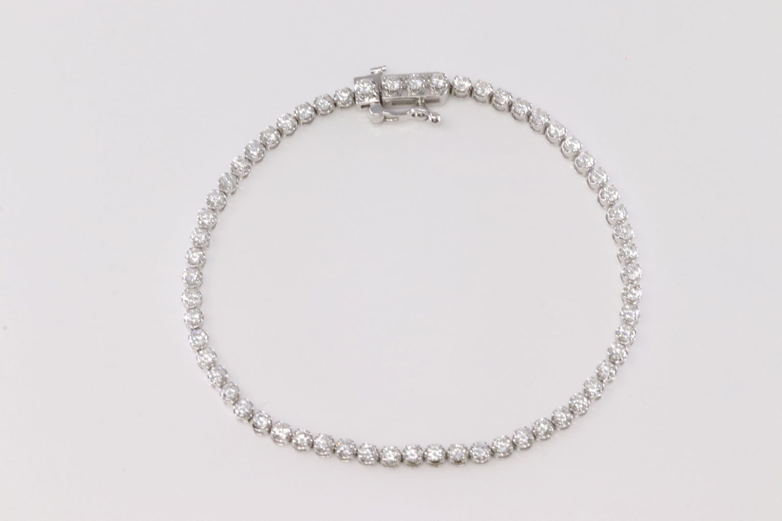 Diamond Tennis Bracelet 14Kt.: 14Kt White Gold Diamond Tennis Bracelet. This Elegant Bracelet has 60 Lab-Grown round Diamonds. Diamonds weight approx: 3.00ctw. Bracelet length: 8.00" Total weight: 6.50 Grams.