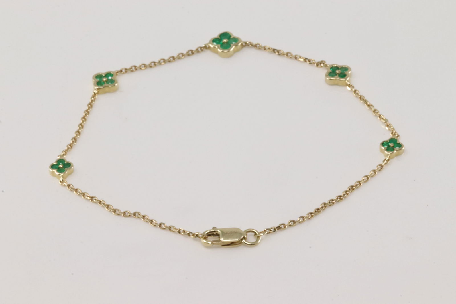 Emerald Flower Bracelet Link 14Kt.: 14Kt Yellow Gold Emerald Flower Bracelet Link. This Bracelet has Flower Deisgn with 20 Green Emeralds. Emeralds weight: 0.41ctw. Bracelet length: 8.00"