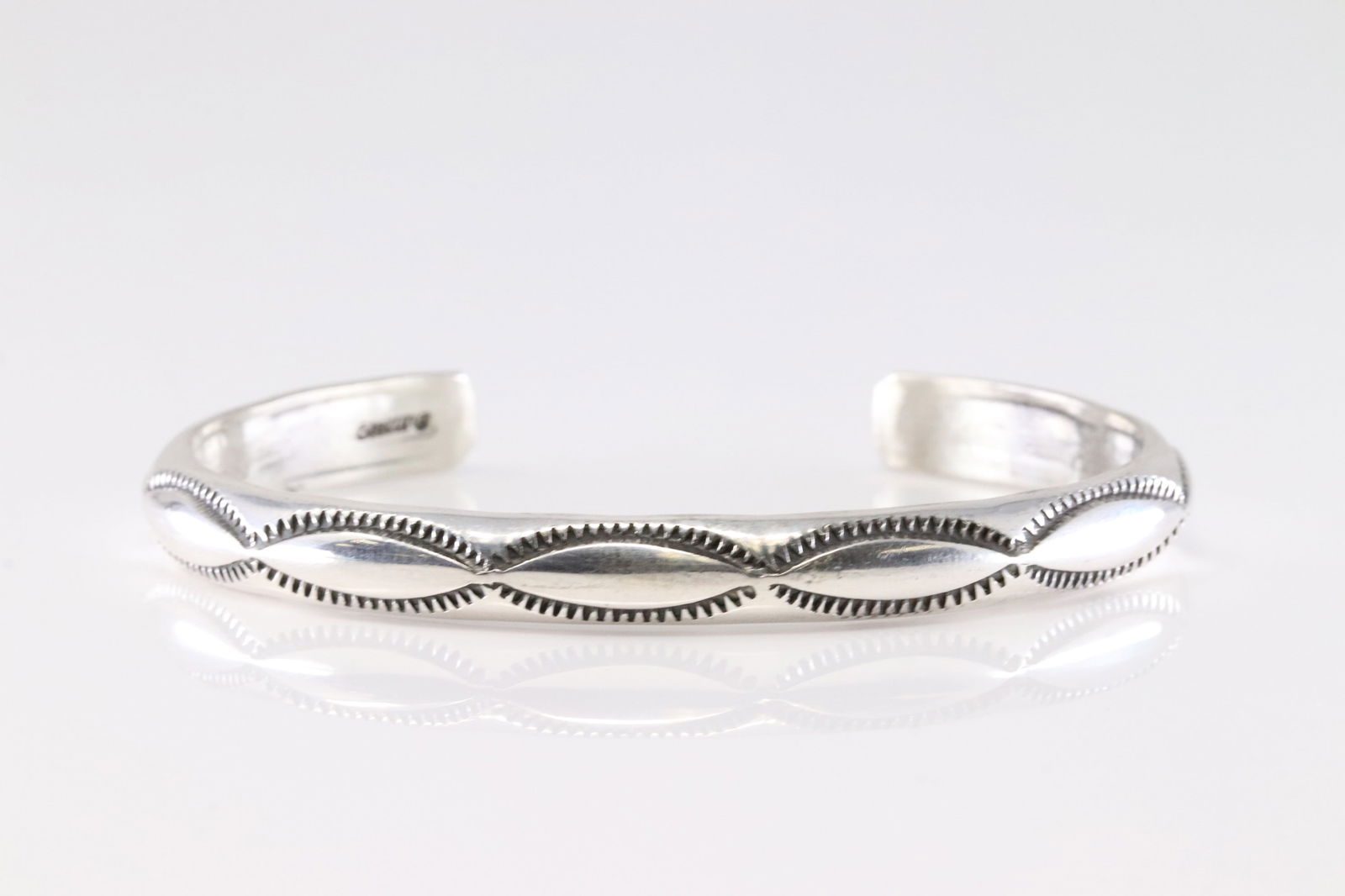 Native America Navajo Sterling Silver Stamped Bracelet Cuff By Elaine Tahe.: This is a Native America Navajo Sterling Silver Stamped Bracelet Cuff By Elaine Tahe.