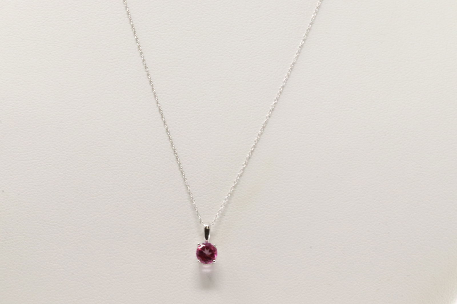 Pink Topaz Pendant / Necklace 10Kt.: Ladies 10Kt White Gold Pink Topaz Pendant / Necklace. This Necklace has A pendant with Pink round Topaz. Necklace length: 18.00"