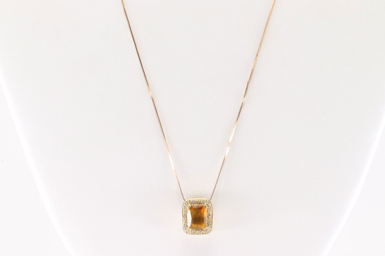 Citrine & Diamond Pendant / Necklace 14Kt.: 14Kt Yellow Gold Citrine & Diamond Pendant / Necklace. This Charming Pendant has Citrine GemstoneOn The center Surrender By 20 Sparkling Diamonds and 10K Necklace. Citrine Measure: 8x6mm. Necklace len