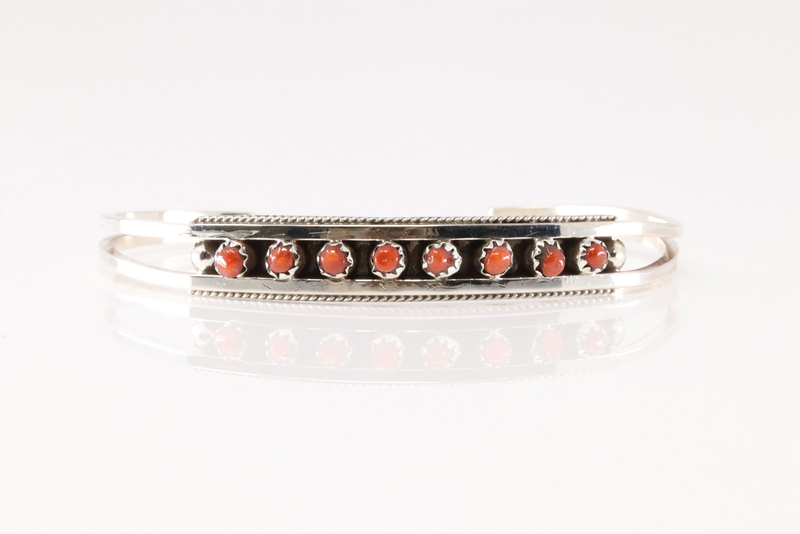 Native America Zuni Sterling Silver Coral Bracelet Cuff By Susie Livingston.: This is a Native America Zuni Sterling Silver Coral Bracelet Cuff By Susie Livingston.