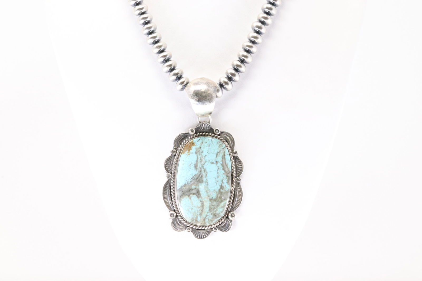 Native America Navajo Sterling Silver Number 8 Turquoise Pendent By Gilbert Tom With None Navajo: This is a Native America Navajo Sterling Silver Number 8 Turquoise Pendent By Gilbert Tom With None Navajo Stearling Silver Pearl Beaded Machine Made Necklace. Necklace Length: 16.00.
