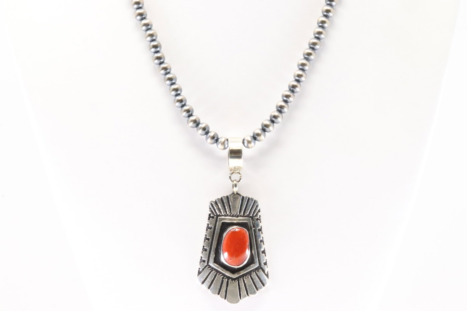 Native America Navajo Sterling Silver Coral Pendant By T&R Singer. With None Navajo Pearl Beaded: This is a Native America Navajo Sterling Silver Coral Pendant By T&R Singer. With None Navajo Pearl Beaded Sterling Silver Machine Made Necklace. Necklace length: 16.00"