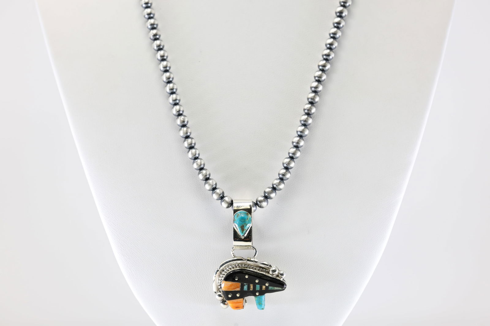 Native America Navajo Sterling Silver Multi-Color Inlay Bear By Ray Jack. With Machine Made Pearl: This is a Native America Navajo Sterling Silver Multi-Color Inlay Bear By Ray Jack. With Machine Made Pearl Beaded Sterling Silver Necklace. Necklace length: 20.00"