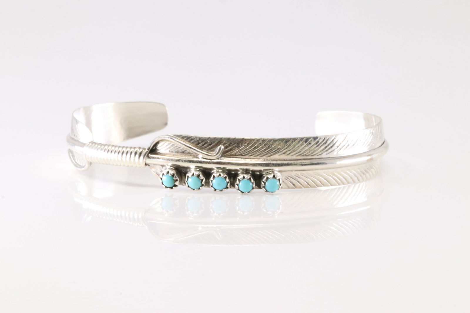 Native America Navajo Sterling Silver Turquoise Feather Bracelet Cuff By Aaron Davis.: This is a Native America Navajo Sterling Silver Turquoise Feather Bracelet Cuff By Aaron Davis. Stamp AD.