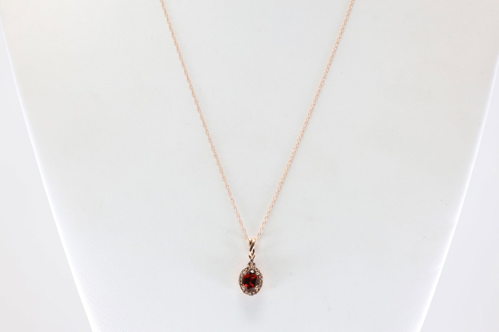 White Sapphire & Garnet Pendant / Necklace 10Kt.: 10Kt Rose Gold White Sapphire & Garnet Pendant / Necklace. This Charming Pendant has Garnet Surrender by White Sapphires And A 10K Rose Necklace. Necklace length: 20.00"