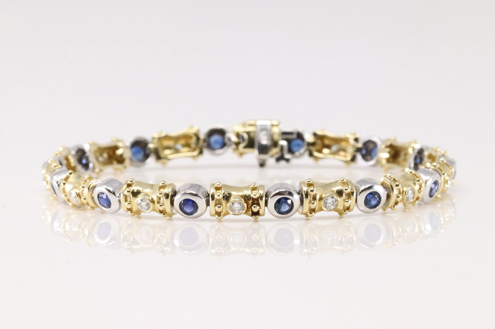 Sapphire & Diamond Bracelet 14Kt.: Ladies 14Kt Yellow Gold Sapphire & Diamond Bracelet. This Elegant Bracelet has 14 Beautiful Sapphire Gems & 14 Round Sparkling Diamonds. Diamonds Approx Weight: 0.50 ctw Bracelet Length: 7.5 inches. T