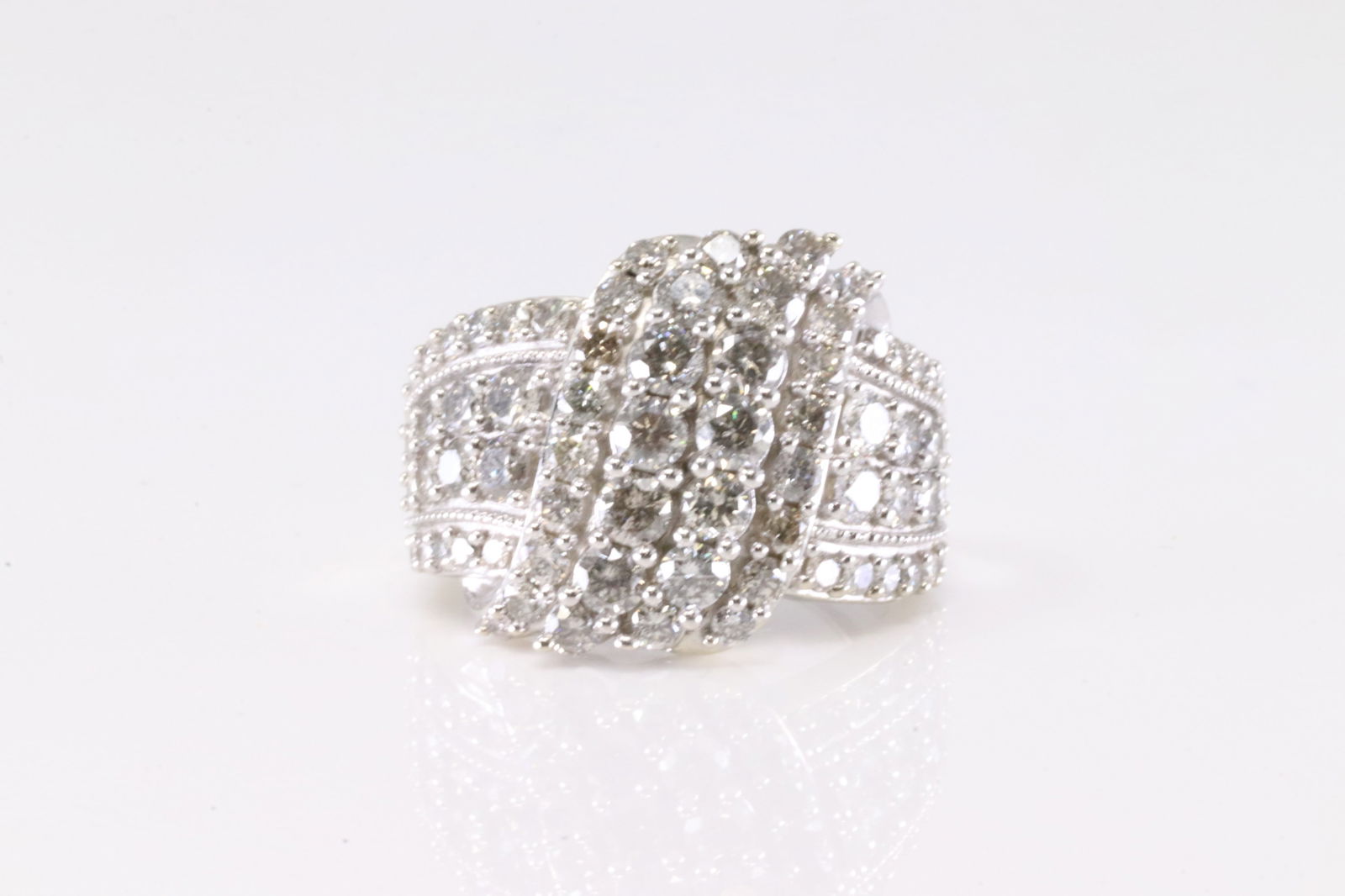 Elegant Diamond Ring 10Kt.: Ladies 10K White Gold Diamond Ring. This Elegant Ring has 78 Brilliants Diamonds. Diamonds wieght approx: 1.80 ctw Ring size: 7.00. Total weight: 7.60 Grams.