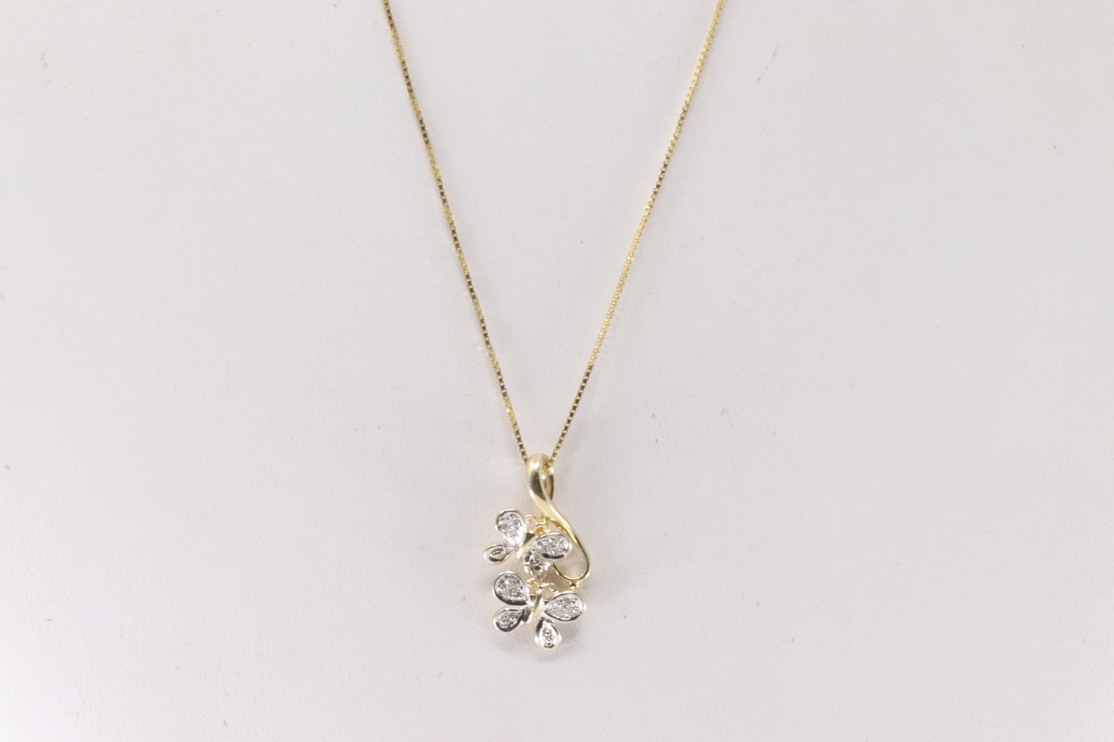Diamond Butterfly Pendant & Necklace 10Kt.: 10Kt Yellow Gold Diamond Butterfly Diamond Pendant & Necklace. This butterfly pendant has 16 smaller round diamonds with a 14k necklace. Necklace length: 18.00" Total weight: 2.60 Grams.