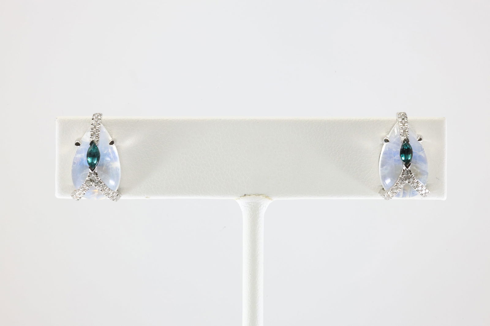 London Blue Topaz / White Stone & Diamond Stud Earring 18Kt.: Ladies 18Kt White Gold London Blue Topaz / White Stone & Diamond Stud Earring . This Elegant Stud Earring has Marquise London Topaz with Sparkling Diamonds and White Stone. Total weight: 4.58 Grams.