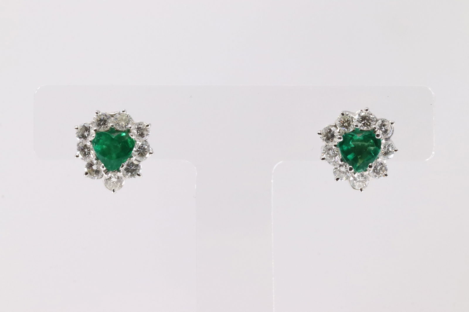 Elegant Emerald & Diamond Stud Earring 14Kt.: Ladies 14Kt White Gold Emerald & Diamond Stud Earring. This Elegant Stud Earring has 2 Center Heart Shape Natural Emerald With 18 Natural Round Diamonds. Measure Emerlad: 6.5 X 5.5 MM. Emerlads