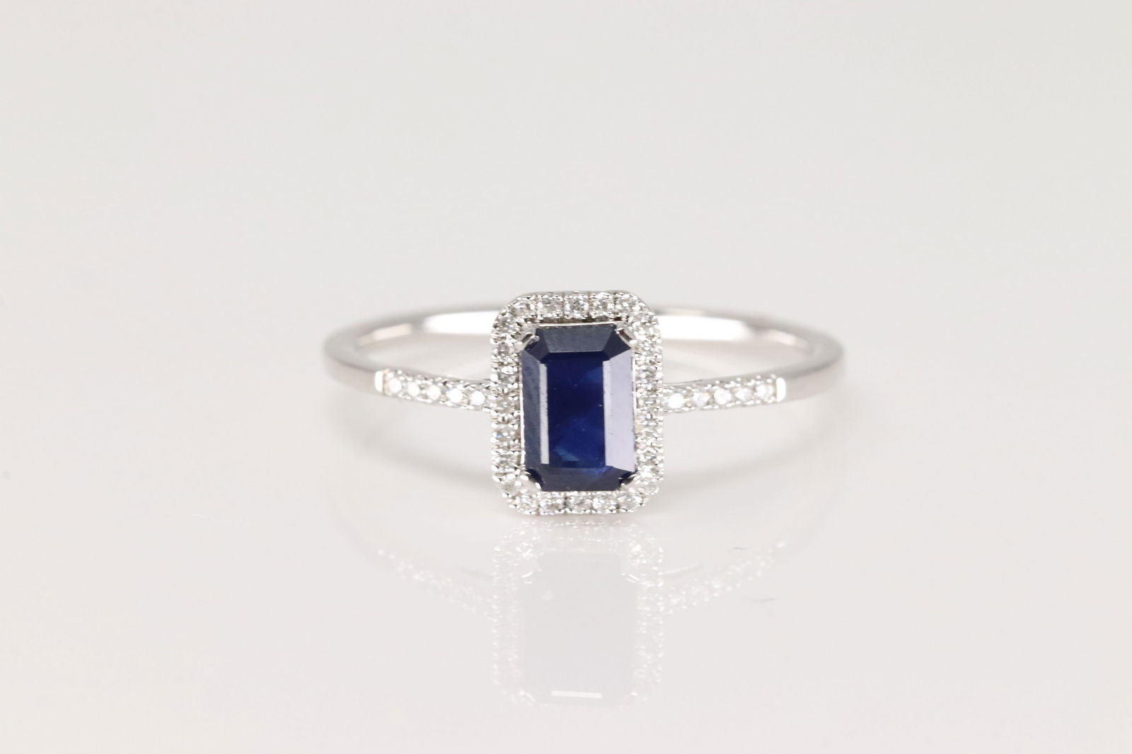 Sapphire & Diamond Ring 14Kt.: Ladies 14Kt White Gold Sapphire & Diamond Ring. This Elegant Ring has Blue Sapphire Surrender by Sparkling Diamonds. Diamonds weight: 0.10ctw. Ring size: 6.50.