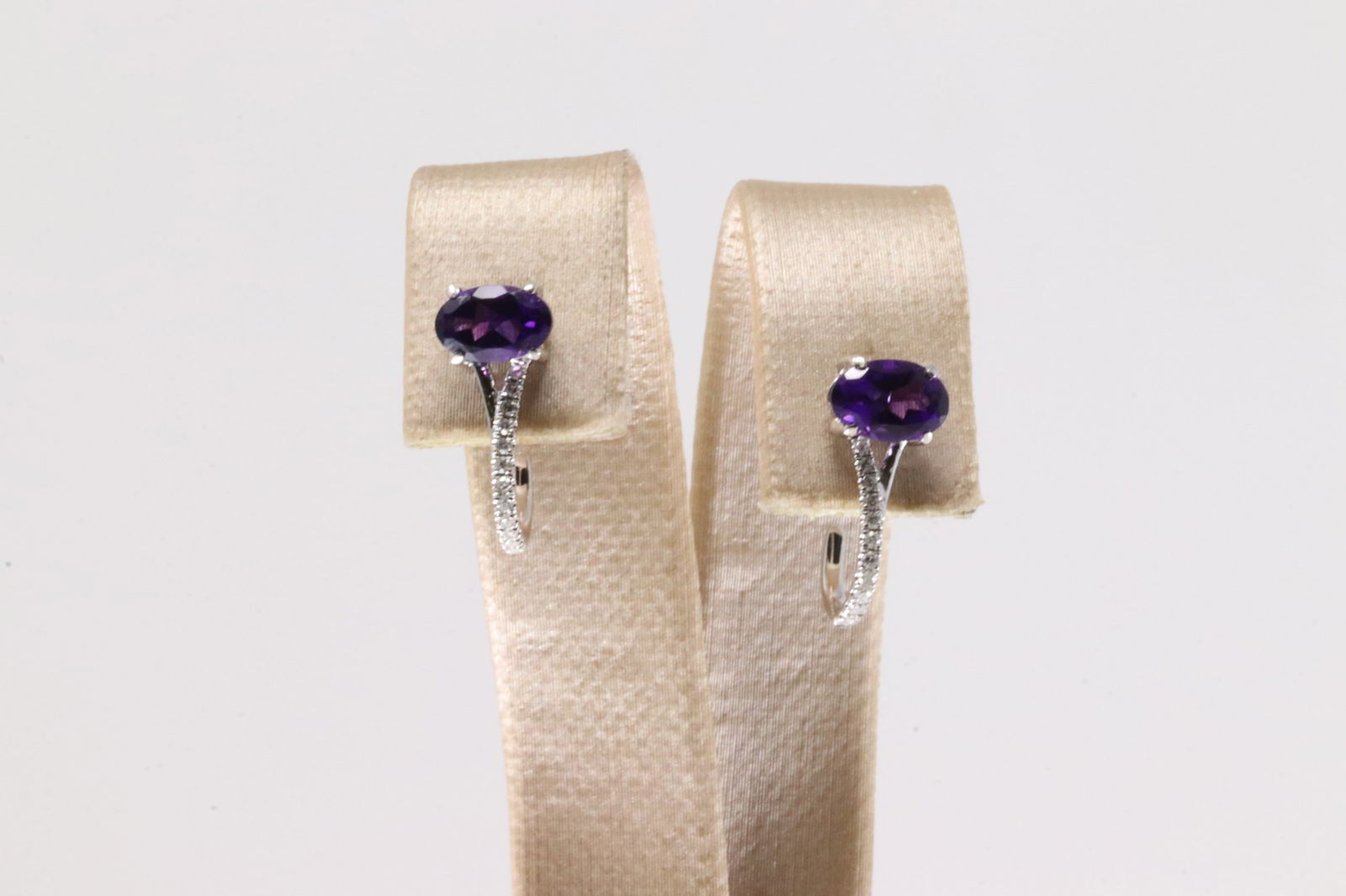 Amethyst & Diamond Hoop Earring 10Kt.: Ladies 10Kt White Gold Amethyst & Diamond Hoop Earring. This Hoop Earring has Amethyts Gems with Sparkling Diamonds. Diamonds weight: 0.10ctw.