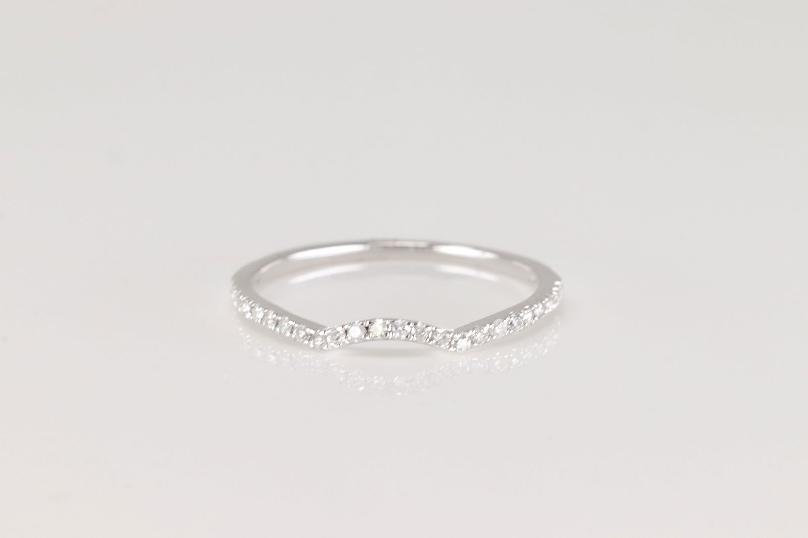 Diamond Ring 14Kt.: Ladies 14Kt White Gold Diamond Ring. This Charming Ring has 24 Sparkling Diamonds. Diamonds weight: 0.14ctw. Ring size: 6.50.