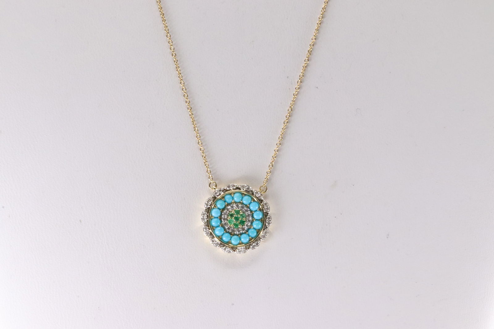 Multi-Gemstone & Diamond Necklace 14Kt.: 14Kt Yellow Gold Multi-Gemstone Necklace. This Necklace has an Charm with Emeralds / Turquoise and 43 round Diamonds. Diamonds weight: 0.20ctw. Necklace length: 20.00" Total weight: 3.50 Grams.