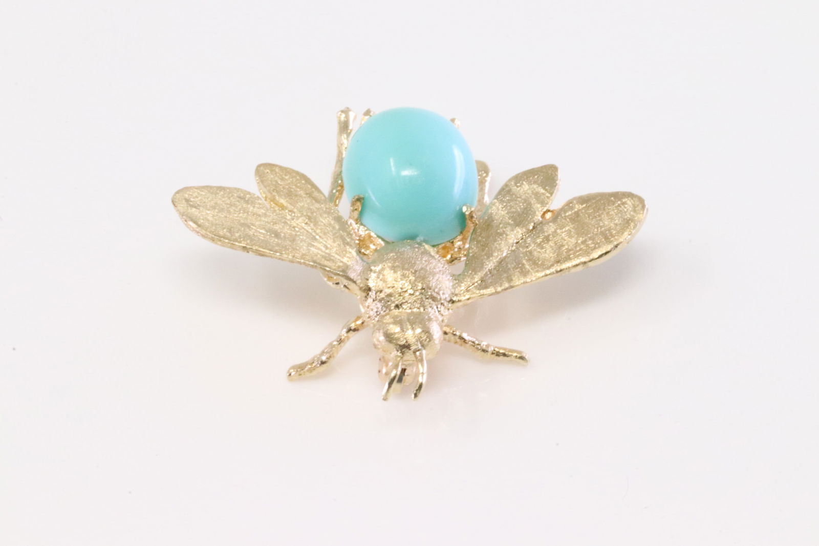 Bee Fly Turquoise Brooch 14Kt.: 14Kt Yellow Turquoise Brooch Bee Fly. Brooch Bee Fly Design with Oval Turquoise. Total weight: 6.00 Grams.