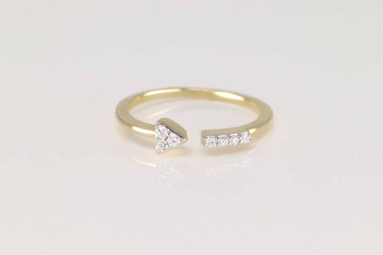 Diamond Open Ring 10Kt.: Ladies 10Kt Yellow Gold Diamond Open Ring. This Elegant Open Ring has 7 Sparkling Diamonds. Diamonds weight: 0.10ctw. Ring size: 7.00.