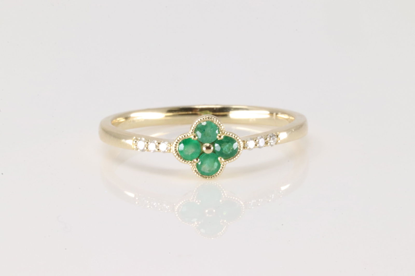 Emerald & Diamond Ring 14Kt.: Ladies 14Kt Yellow Gold Emerald & Diamond Ring. This ring has flower design with 4 emeralds with 6 round diamonds. Emeralds weight: 0.16ctw. Diamonds weight: 0.04ctw. Ring size: 6.50.