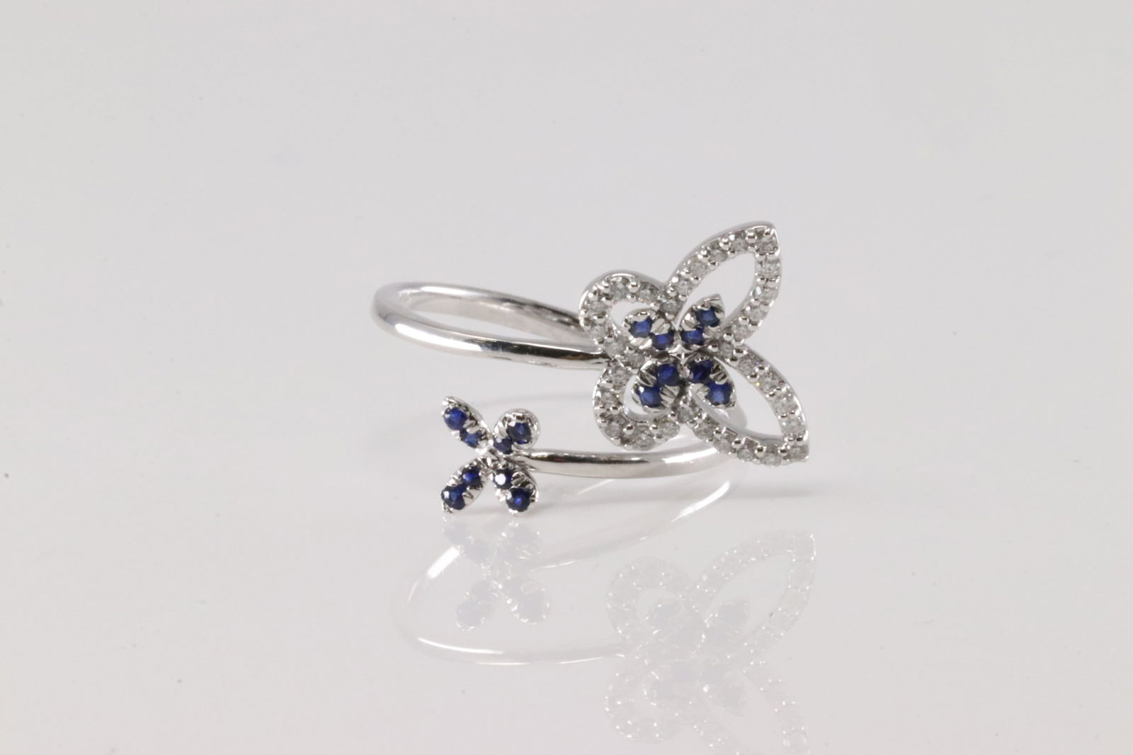 Sapphire & Diamond Butterfly Ring 14Kt.: Ladies 14Kt White Gold Sapphire & Diamond Butterfly Ring. This Butterfly Ring has Blue Sapphires with 32 round Diamonds. Diamonds weight: 0.16ctw. Ring size: 7.00.
