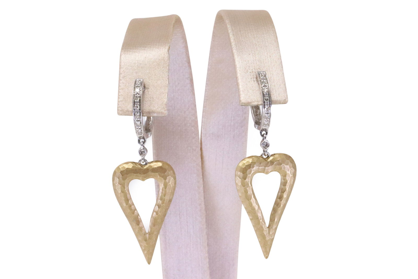Diamond Heart Earring 14Kt.: Ladies 14Kt Yellow Gold Diamond Heart Earring. These exquisite heart-shaped earrings feature a unique blend of elegance and charm. Crafted with precision, the golden hearts dangle gracefully from