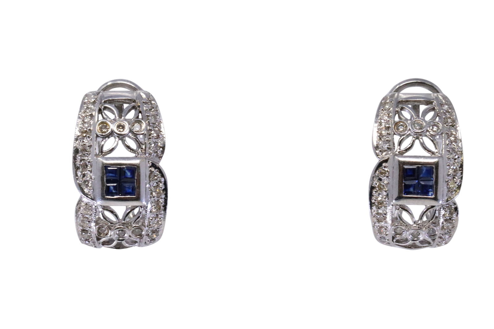 14KT Diamond / Sapphire Earrings: A ladies 14kt White Gold Diamond earrings. Earrings has a total of 52 round diamonds and 8 Blue Sapphire stones. Backing: French backing style. Total weight: 9.20 grams.