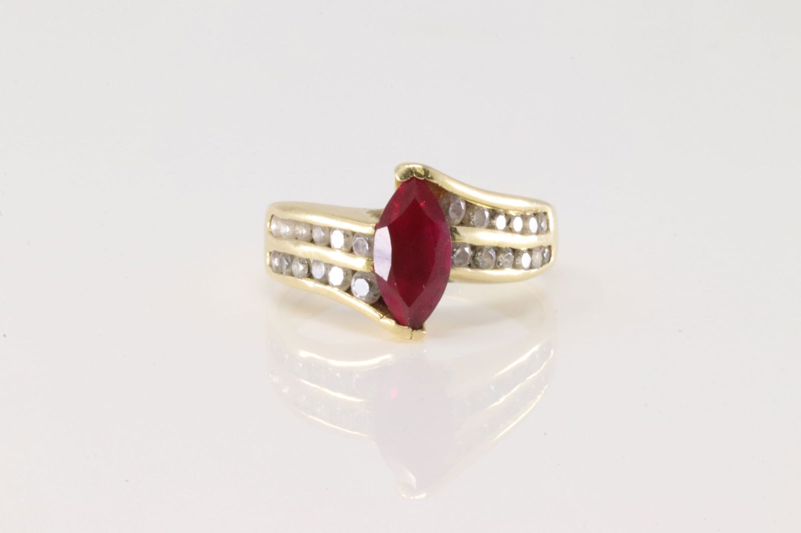 Marquise Ruby & Diamond Ring 18Kt.: Ladies 18Kt Yellow Gold Marquise Ruby & Diamond Ring. This elegant ring has marquise ruby with 24 sparkling diamonds. Diamonds weight approx: 0.75ctw. Ring size: 6.50. Total weight: 5.40 Grams.
