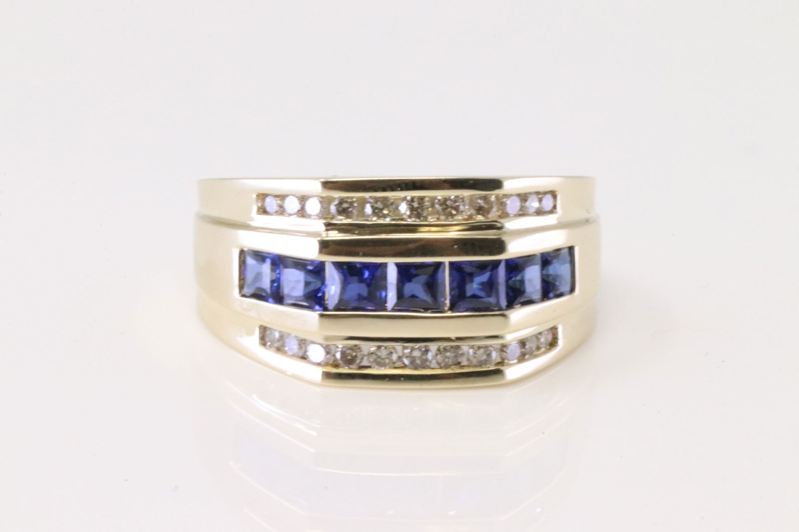 Sapphire & Diamond Ring 10Kt.: 10Kt Yellow Gold Sapphire & Diamond Ring. Ring has 7 Princes Cut Sapphire With 2 row 22 round Diamonds. Diamonds approx weight: 1.00ctw. Ring size: 9.50. Total weight: 7.80 Grams.