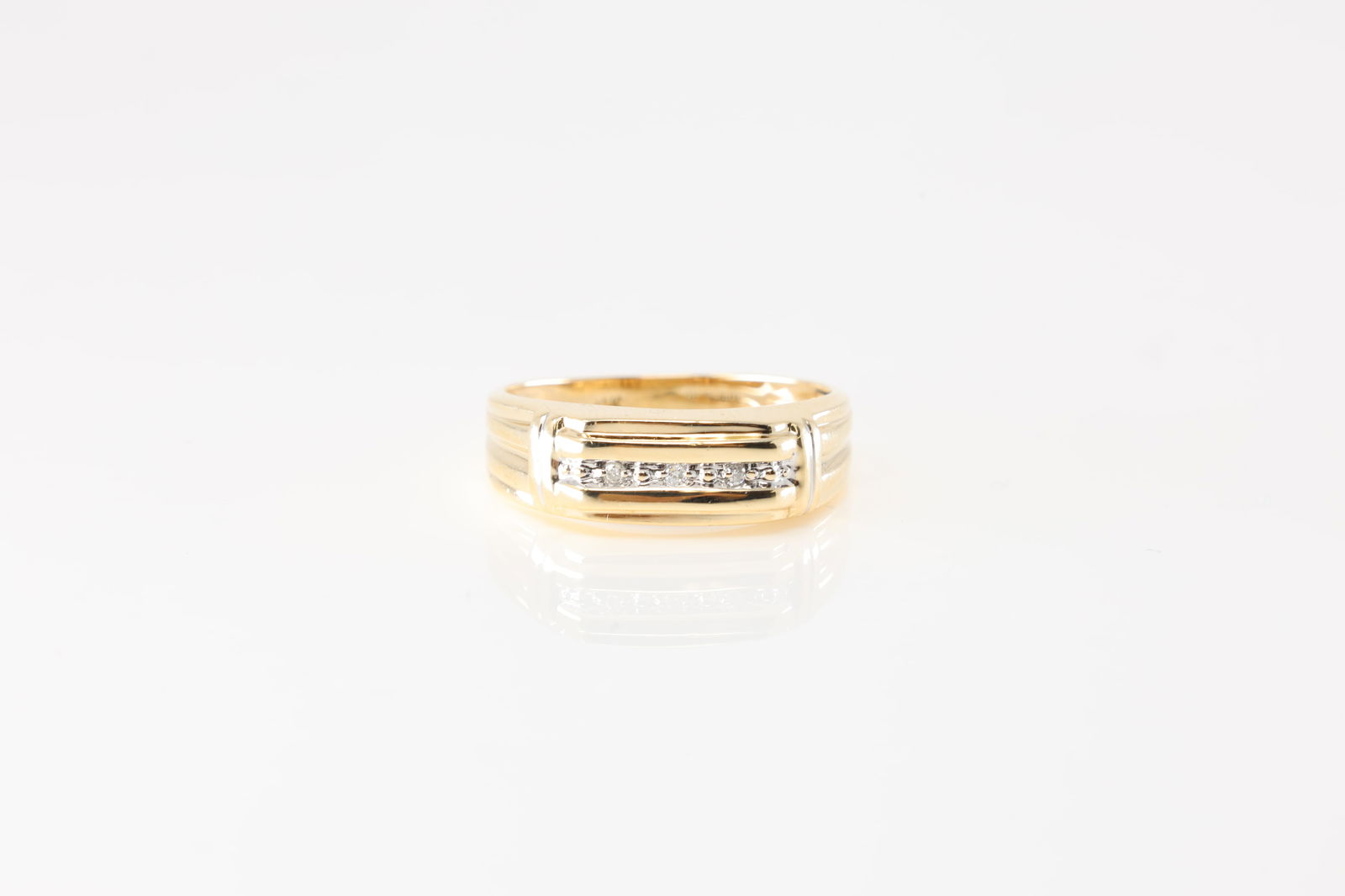 Diamond Ring 10Kt.: 10Kt Yellow Gold Diamond Ring. This exquisite gold ring features a sleek design with a row of sparkling diamonds, perfect for adding a touch of elegance to any outfit. Its timeless style makes it a