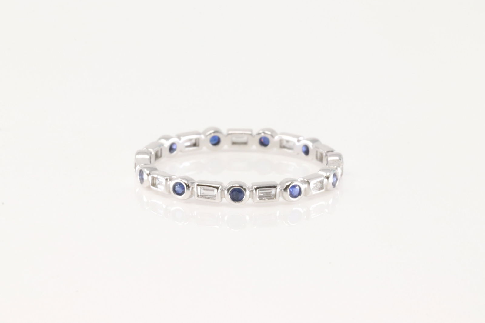 Sapphire & Diamond Ring 14Kt.: Ladies 14Kt White Gold Sapphire & Diamond Ring. This Ring has 11 Brilliant Diamonds & 11 Gorgeous Sapphire Gemstones. Diamond Weight: 0.33ct. Ring Size: 6.45. Total Weight:1.30 Grams.
