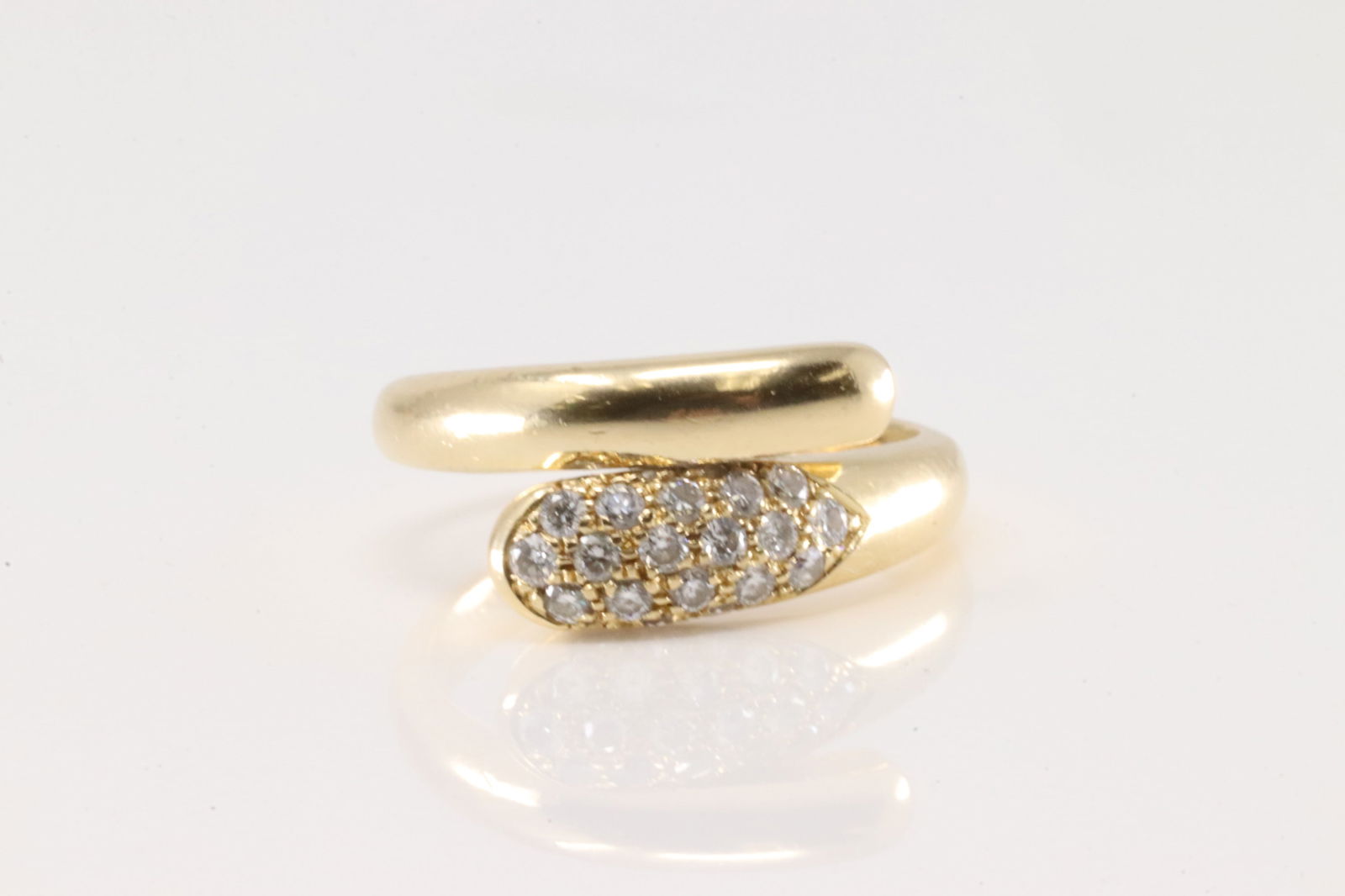 Bvlgari Diamond Bypass Ring 18Kt.: Bvlgari Ladies 18Kt Yellow Gold Diamond Bypass Ring. This elegant ring has 20 round brilliants diamonds. Diamonds weight approx: 0.50ctw. Ring size: 6.00. Total weight: 5.60 Grams.