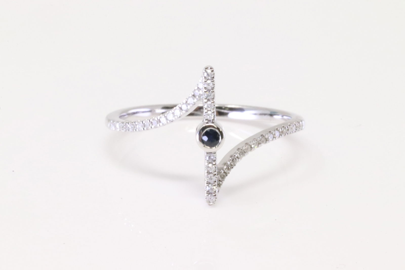 Sapphire & Diamond Ring 10Kt.: Ladies 10Kt White Gold Sapphire & Diamond Ring. Ring has one Sapphire in the center with roun Diamonds. Diamonds weight: 0.15ctw. Ring size: 7.25.