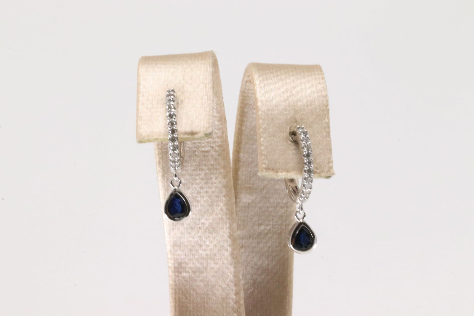 Sapphire & Diamond Hoop Earring 10Kt.: Ladies 10Kt White Gold Sapphire & Diamond Hoop Earring. This Charming Hoop Earring's has Blue Sapphire's with Sparkling Diamonds. Diamonds weight: 0.10ctw.
