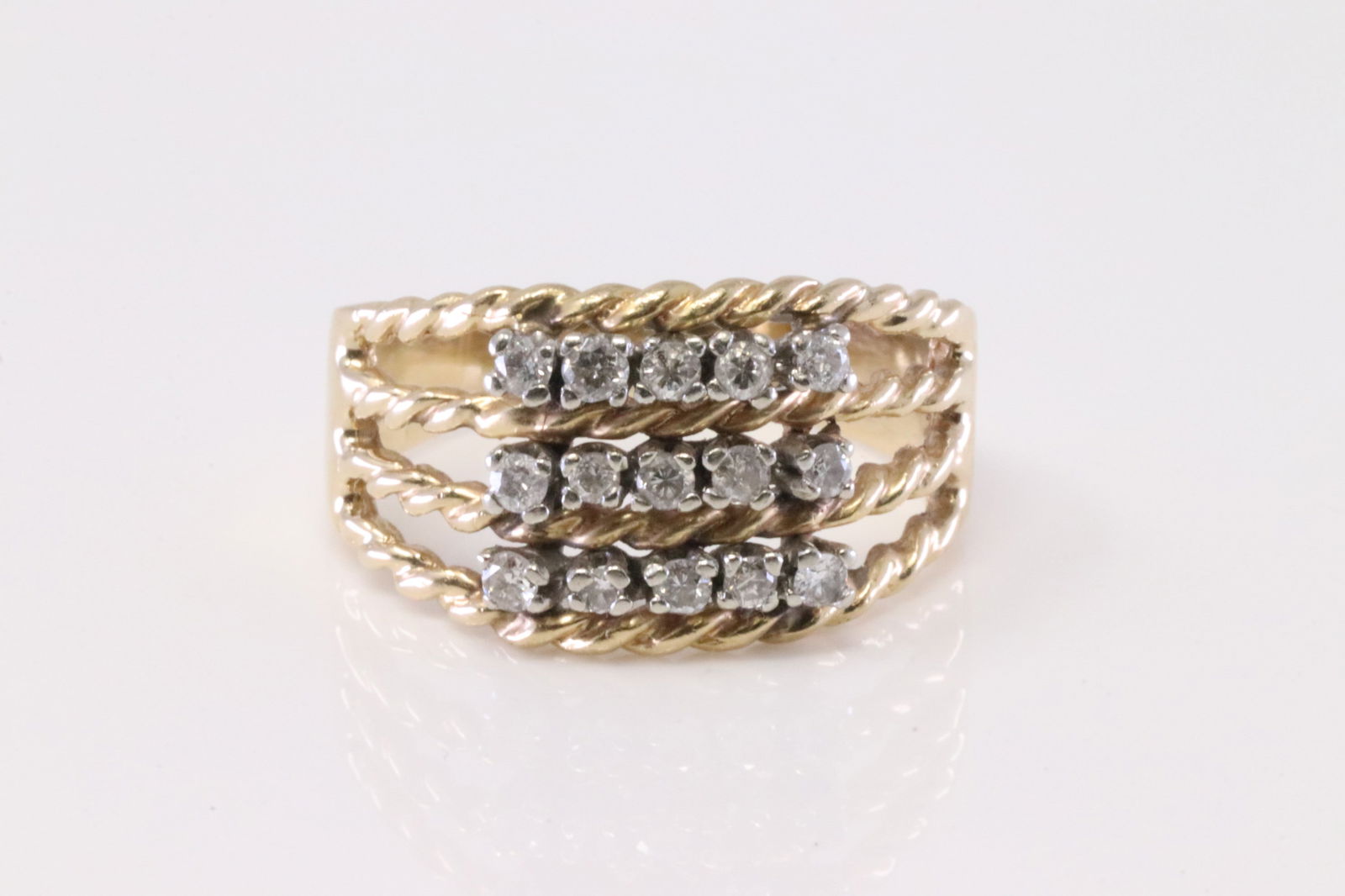 Diamond Ring 14Kt.: 14Kt Yellow Gold Diamond Ring. Ring has 3 Row with 15 round Diamonds. Diamonds weight: approx 0.30ctw. Ring size: 8.00. Total weight: 5.10 Grams.