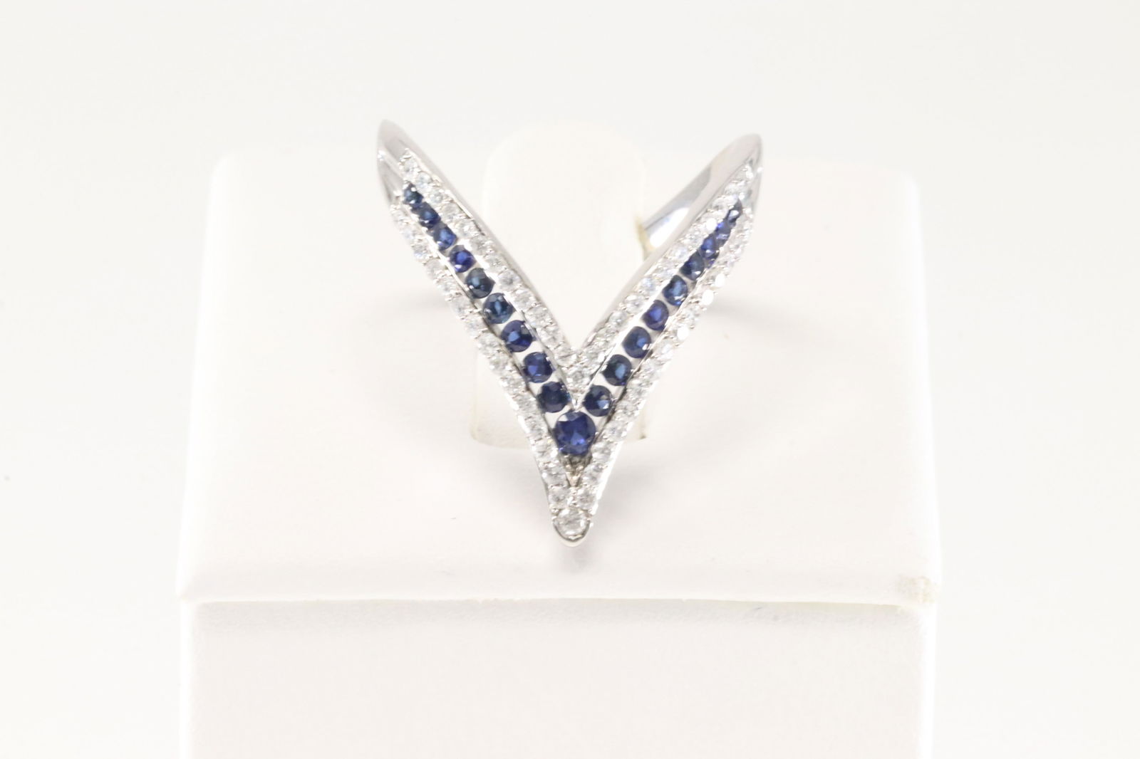 Sapphire & Diamond Ring 14Kt.: Ladies 14Kt White Gold Sapphire & Diamond Ring. This Elegant Ring has 56 Round Sparkling Diamonds & 19 Blue Sapphire Gemstones. Diamond Weight: 0.37ct. Sapphire Weight: 0.38ct. Ring Size: 6.50. Total