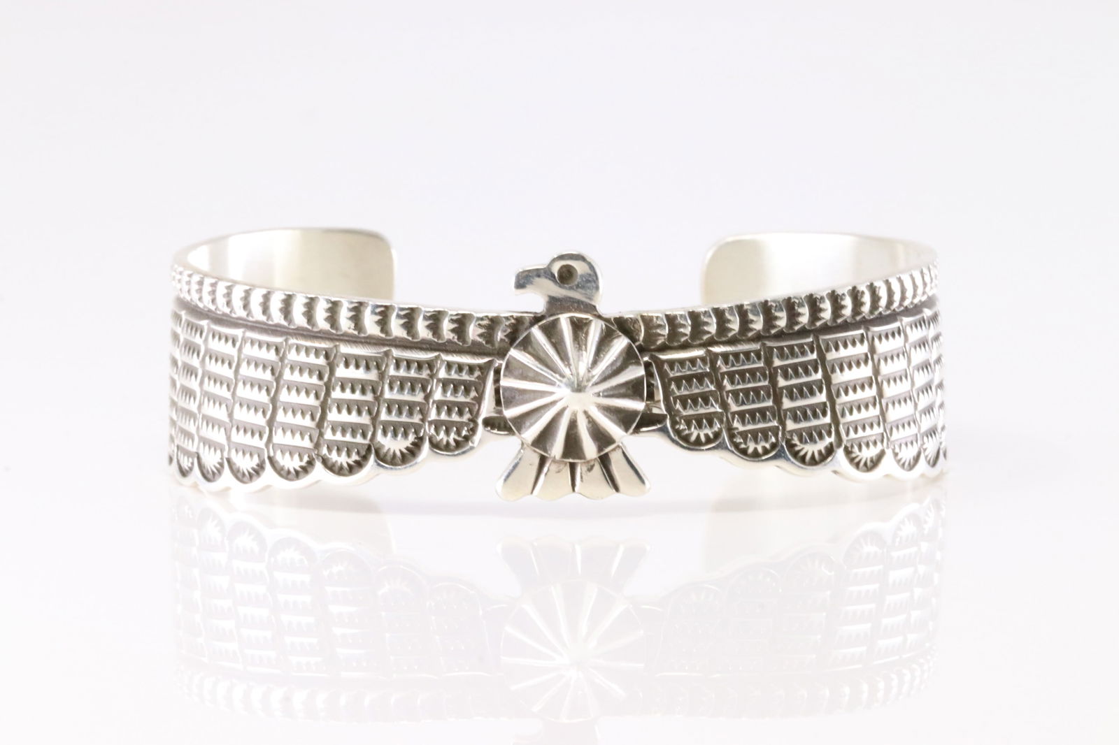 Native America Navajo Sterling Silver Solid Stamped Thunderbird Bracelet Cuff By Darrell Cadman.: This is a Native America Navajo Sterling Silver Solid Stamped Thunderbird Bracelet Cuff By Darrell Cadman. Stamp D.Cadman.