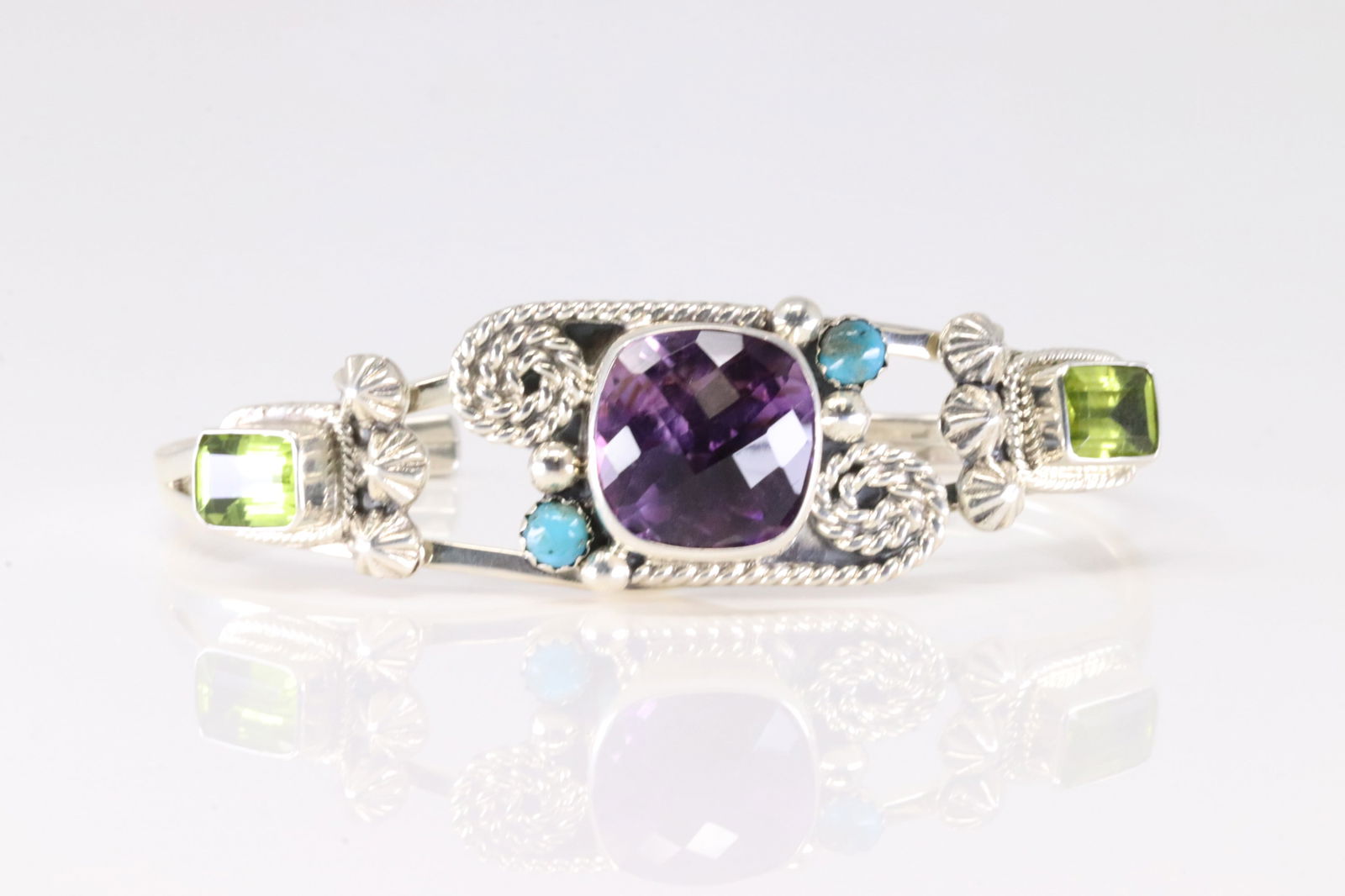 Native America Navajo Sterling Silver Amethyst & Turquoise Bracelet Cuff By Emerson Delgarito. From: This is a Native America Navajo Sterling Silver Amethyst & Turquoise Bracelet Cuff By Emerson Delgarito. Fromp R.B Company. Stamp R.B.