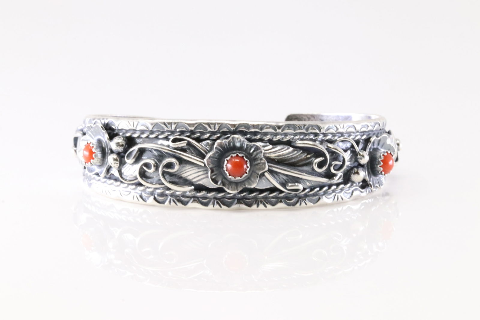 Native America Navajo Sterling Silver Coral Floral Bracelet Cuff By Bessie Joe.: This is a Native America Navajo Sterling Silver Coral Floral Bracelet Cuff By Bessie Joe. Stamp BJ.