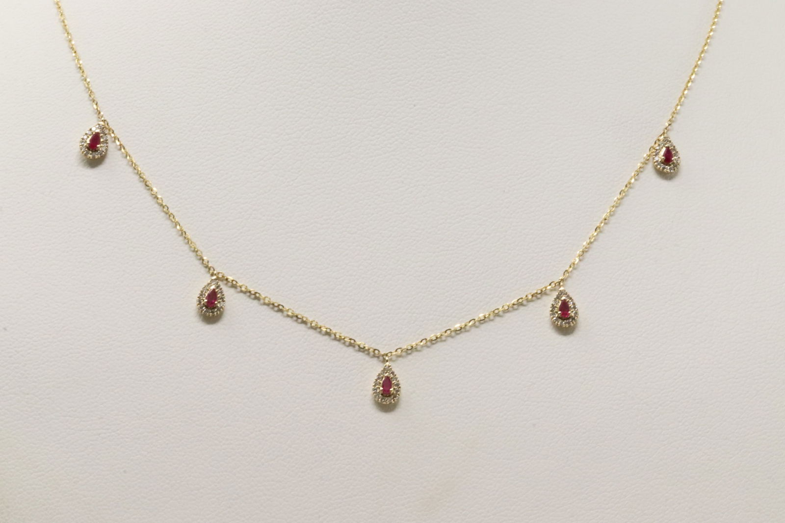 Ruby & Diamond Necklace 14Kt.: Ladies 14Kt Yellow Gold Ruby & Diamond Necklace. This Necklace has Pink Rubies with Saprkling Diamonds. Diamonds weight: 0.23ctw. Necklace length: 18.00" Total weight: 2.40 Grams.