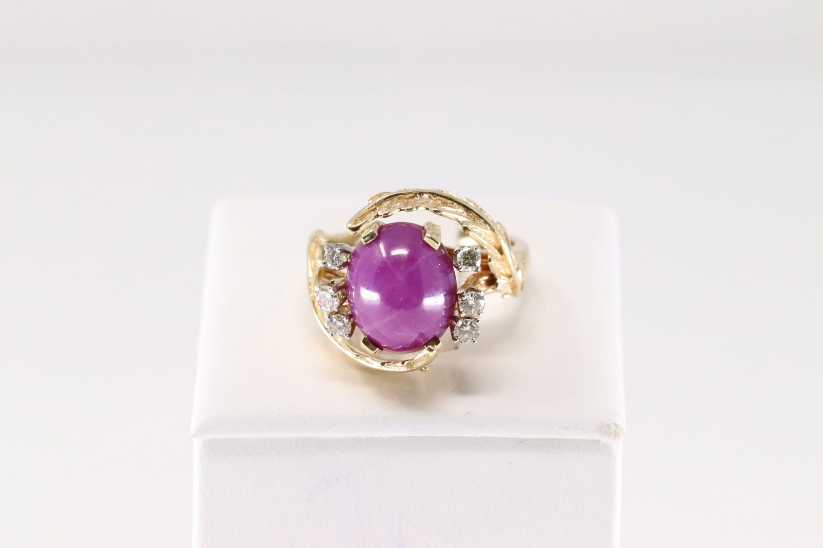 Ruby Star Sapphire & Diamond Ring 18Kt.: Ladies 18Kt Yellow Gold Ruby Star Sapphire & Diamond Ring. This Elegant Ring has Pink Ruby Star Sapphire with 6 Brilliants Diamonds to the sides. Diamonds weight approx: 0.20 ctw Ring size: 7.00.